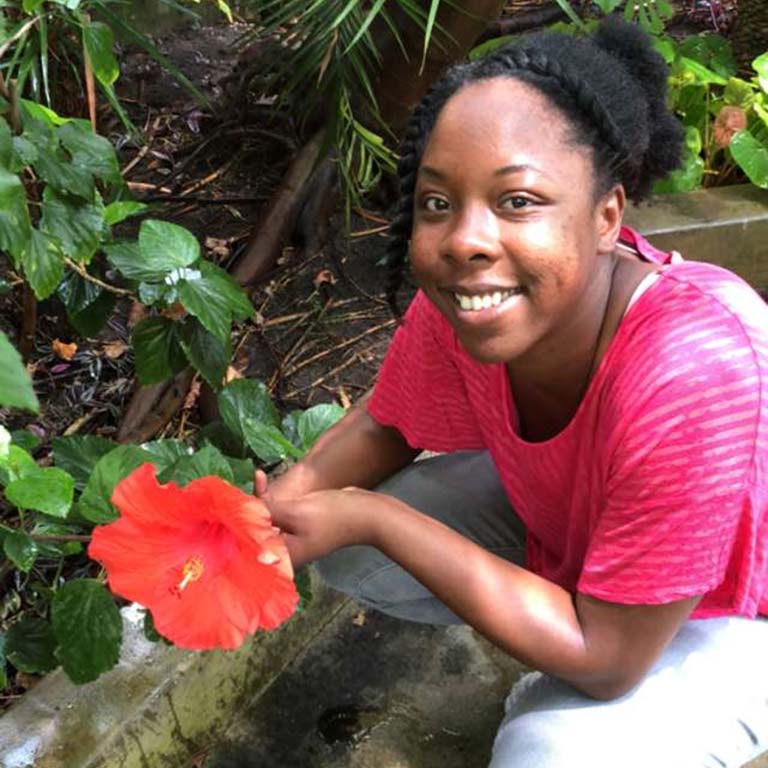 Lekeah Durden in greenhouse.