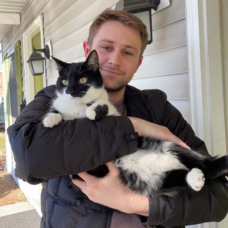 Luke Gohmann and his cat Kona.