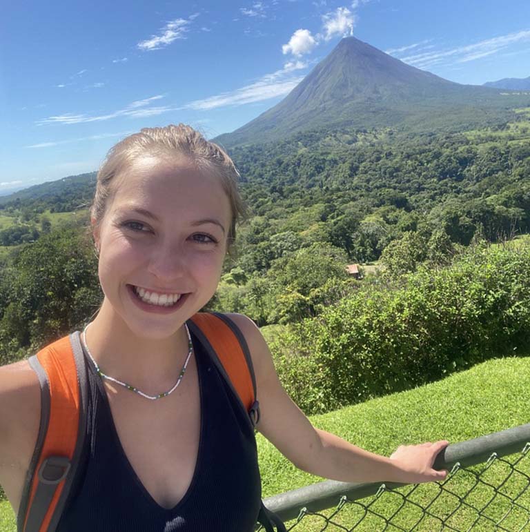 Piper Zola during her study abroad trip to Costa Rica. Volcan Arenal is seen in the background.