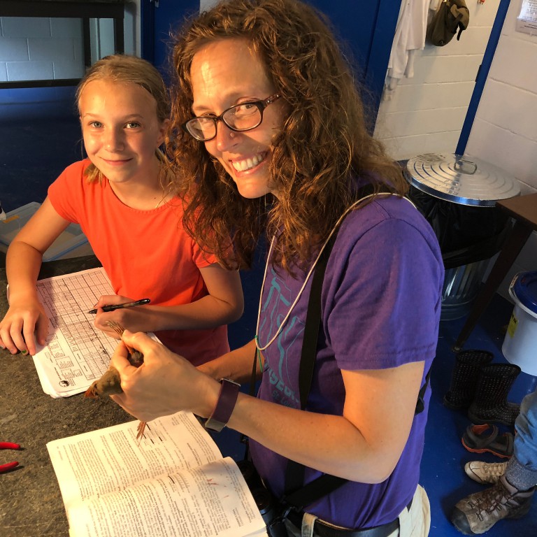 Eve Cusack, right, and Maggie Allen, daughter of Environmental Resilience Institute assistant director Eva Allen, inside the banding station.