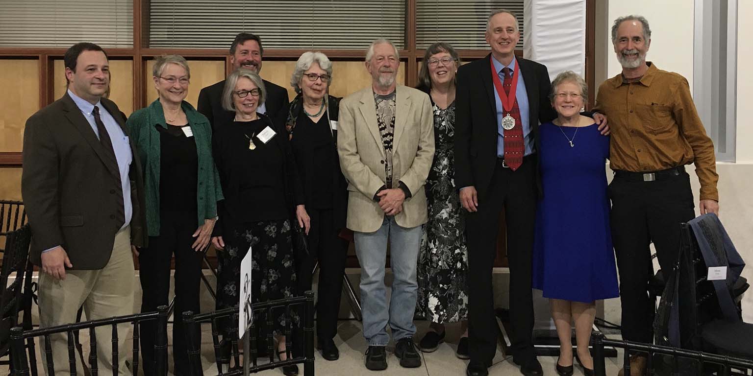 Jeff Palmer poses with fellow IU Biology faculty members after being awarded the IU President's Medal for Excellence. Left to right:  Greg Demas, Ellen Ketterson, Patricia Foster, Clay Fuqua (behind Foster), Elizabeth Raff, Roger Hangarter, Lynda Delph, Palmer, Mimi Zolan, and Roger Innes.