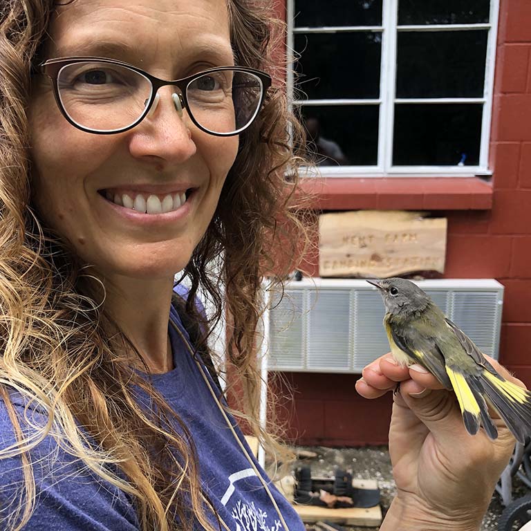 Eve Cusack with female American Redstart.