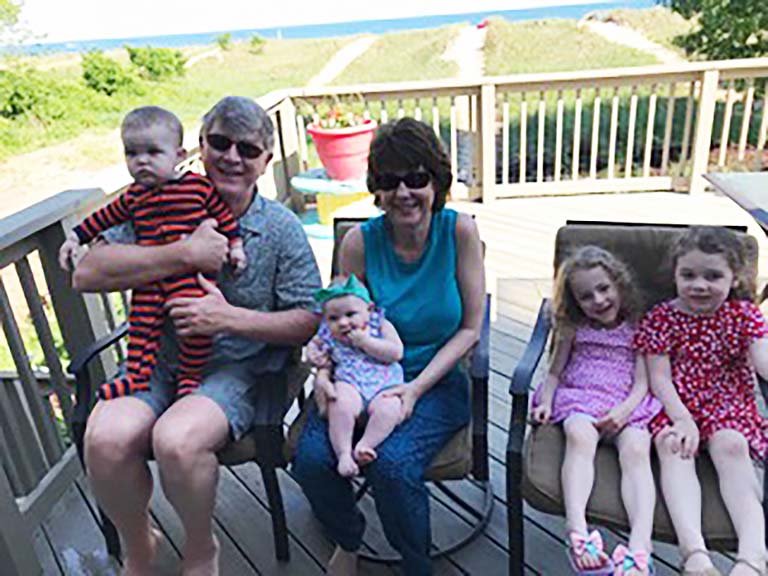 Craig and Diane Pikaard with their four grandchildren.
