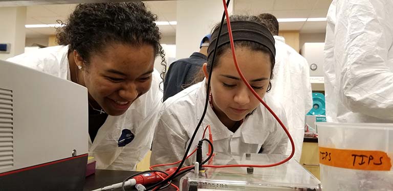 Leilanu Jackson (left) and another student participate in a DNA analysis with gel electrophoresis project during IU's Jim Holland Summer Science Programs.