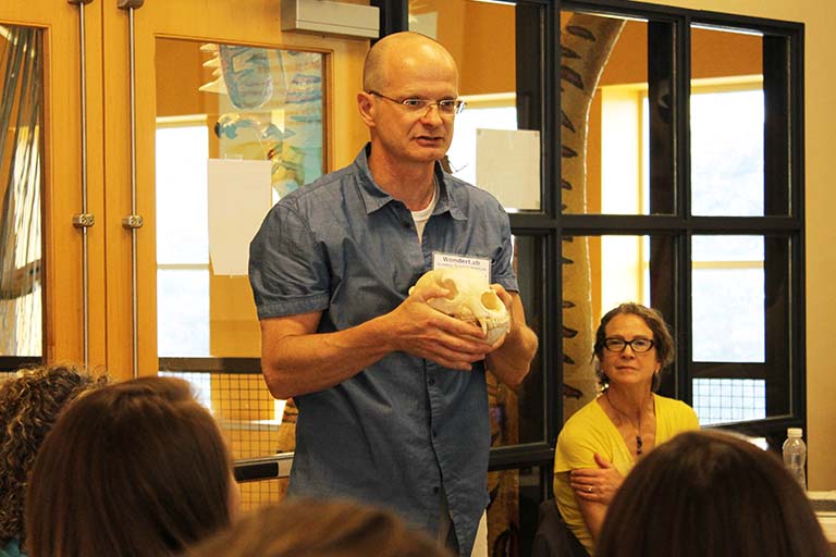 Armin Moczek presents the 'skulls' module during a teachers workshop at WonderLab in 2017. Karen Jepson-Innes (right) watches.