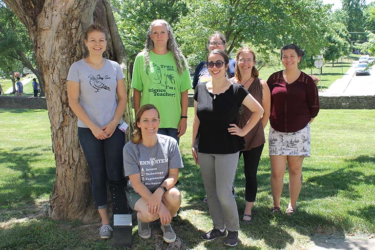 Seven high school science teachers who attended 2022 IU Biology Summer Institute pose for a group photo on the lawn in front of the Biology Building on the IU Bloomington campus.